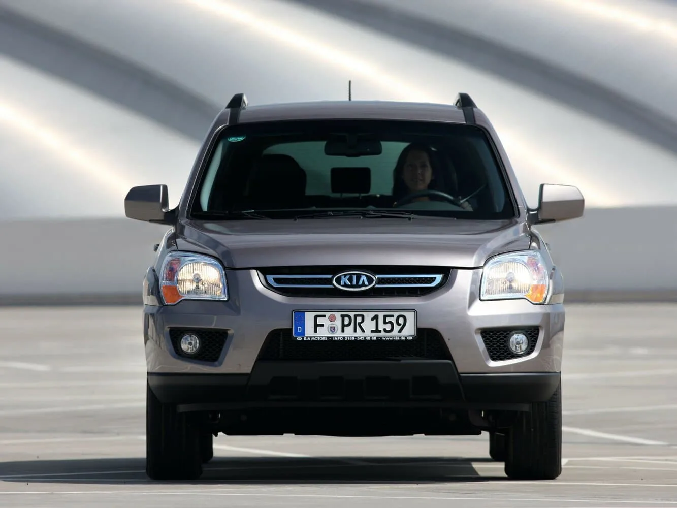 Kia Sportage II Рестайлинг — фото 2